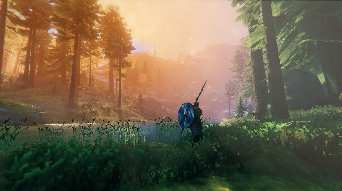 Valheim player scouting distant terrain before moving to a harder biome
